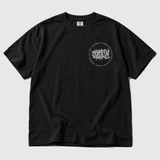 Album Titles Pocket Splatter front product mockup: original artwork composited onto a realistic black Comfort Colors shirt flatlay. Neutral light gray background.