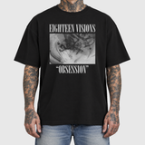 UK Tour model front mockup: original artwork composited onto a realistic black cotton shirt worn by an AI-generated tattooed model. Neutral light gray background.