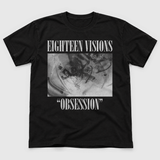 UK Tour product front mockup: original artwork composited onto a realistic black cotton shirt flatlay. Neutral light gray background.